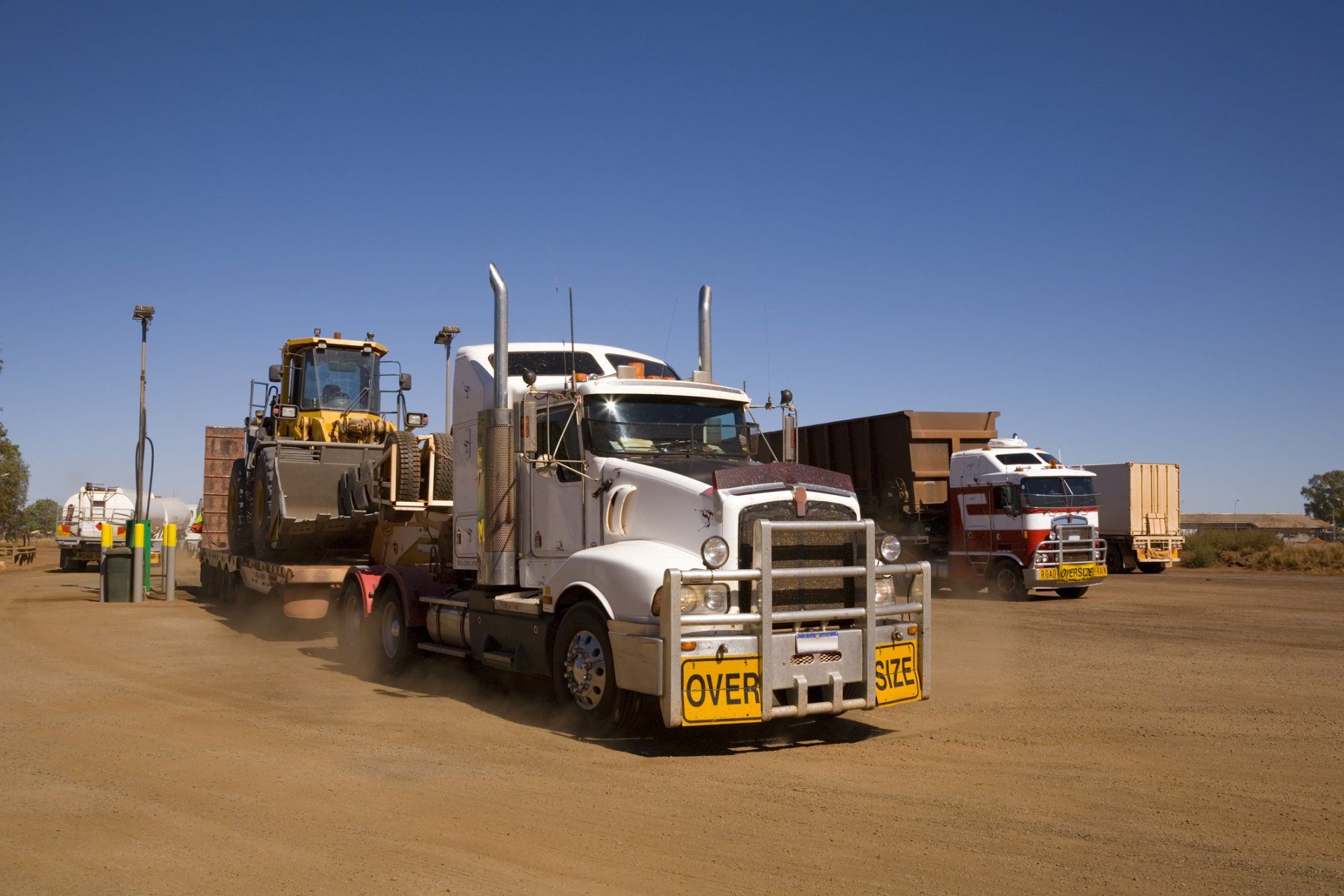 Oversize trucks in sandy soil | Birch Run, MI | Duane Jones Excavating