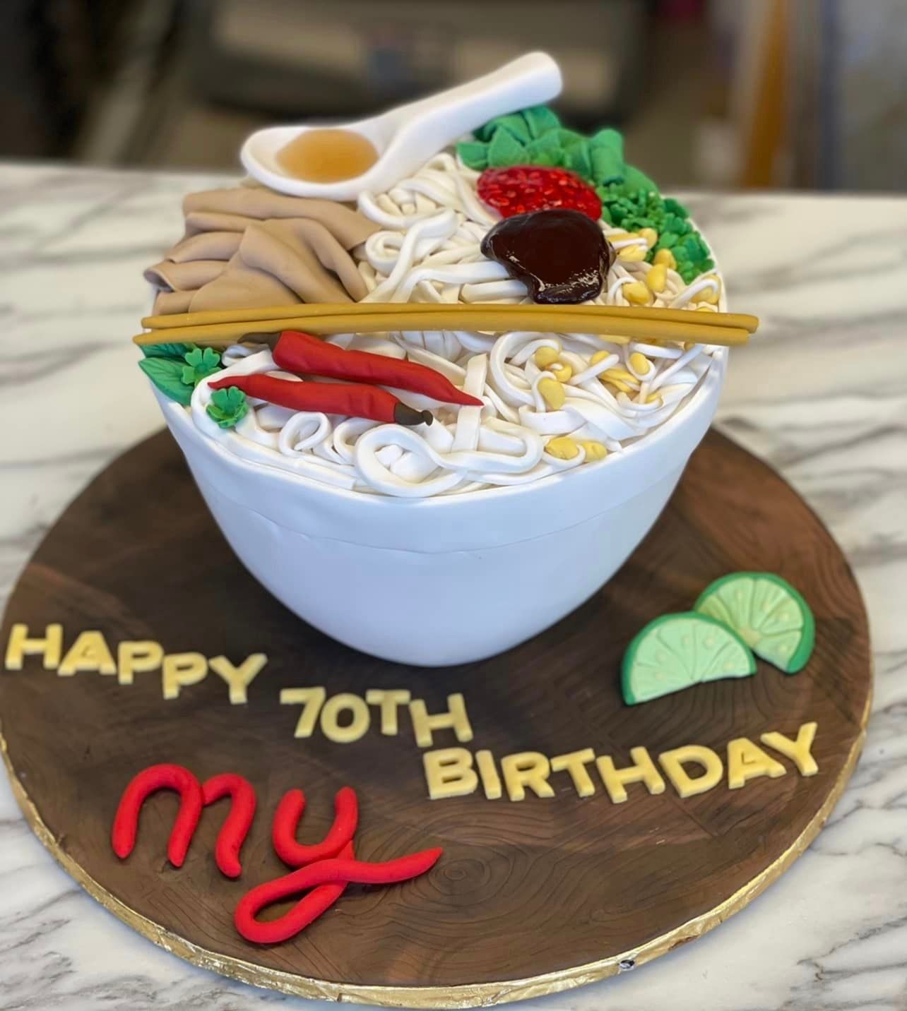 A 70th birthday cake that looks like a bowl of noodles