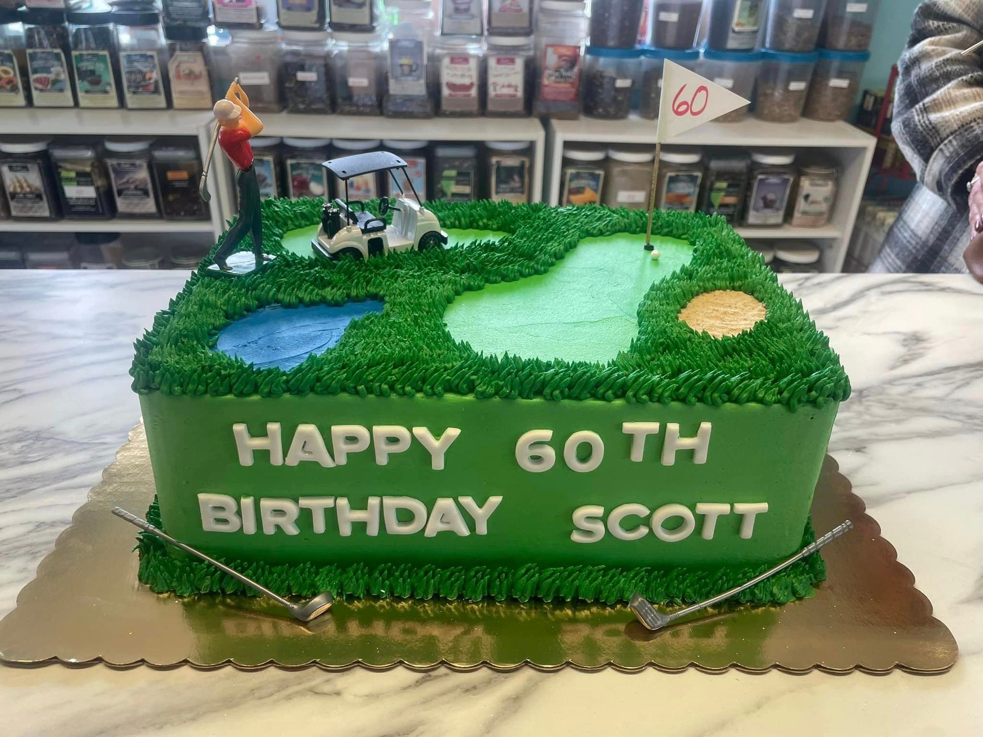 A 60th birthday cake with a golf course on it
