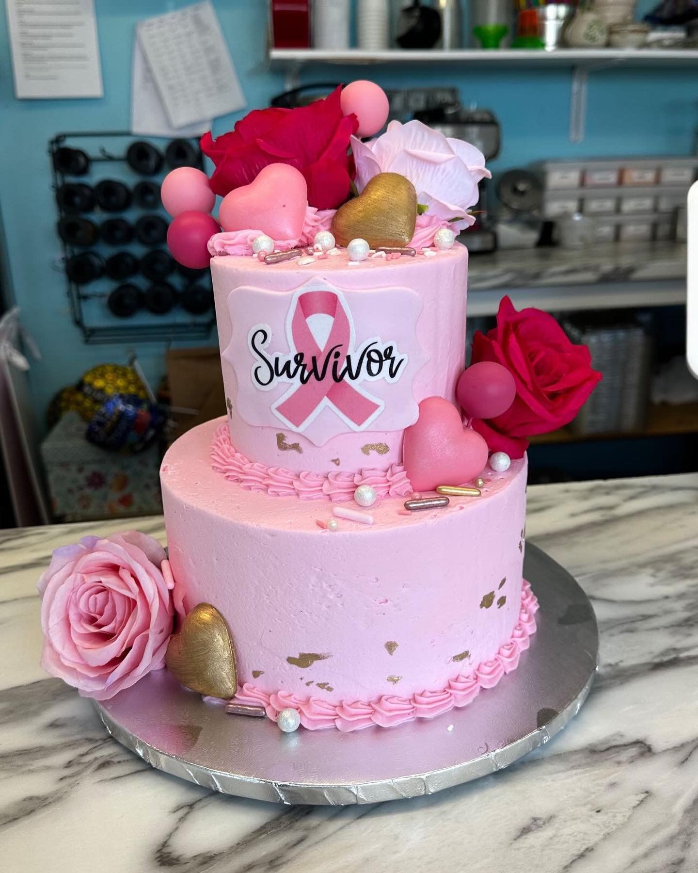 A pink cake with the word survivor on it
