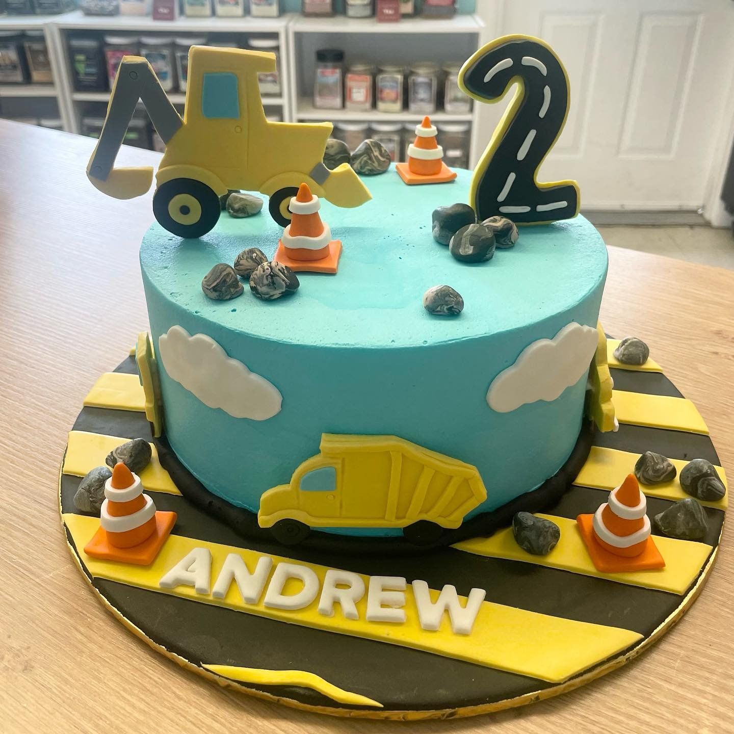 A birthday cake with the name andrew on it