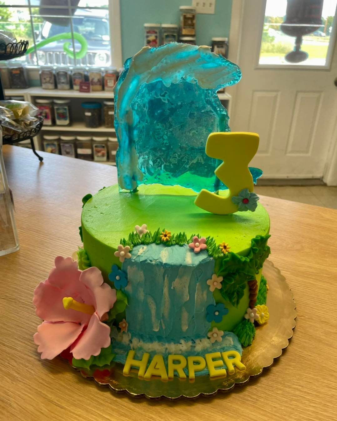 A birthday cake with a waterfall and the name harper on it