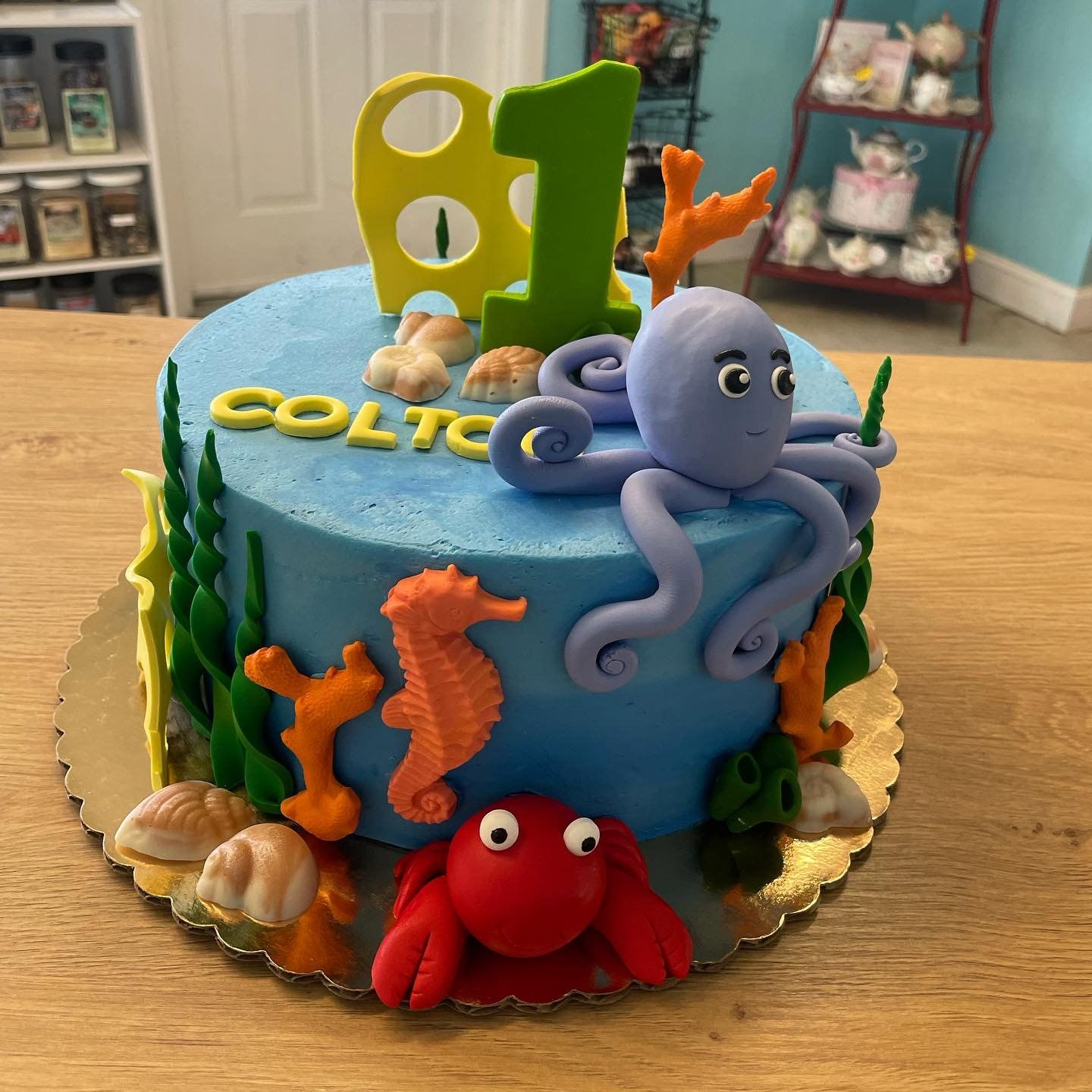 A birthday cake for colt is decorated with octopus and sea creatures