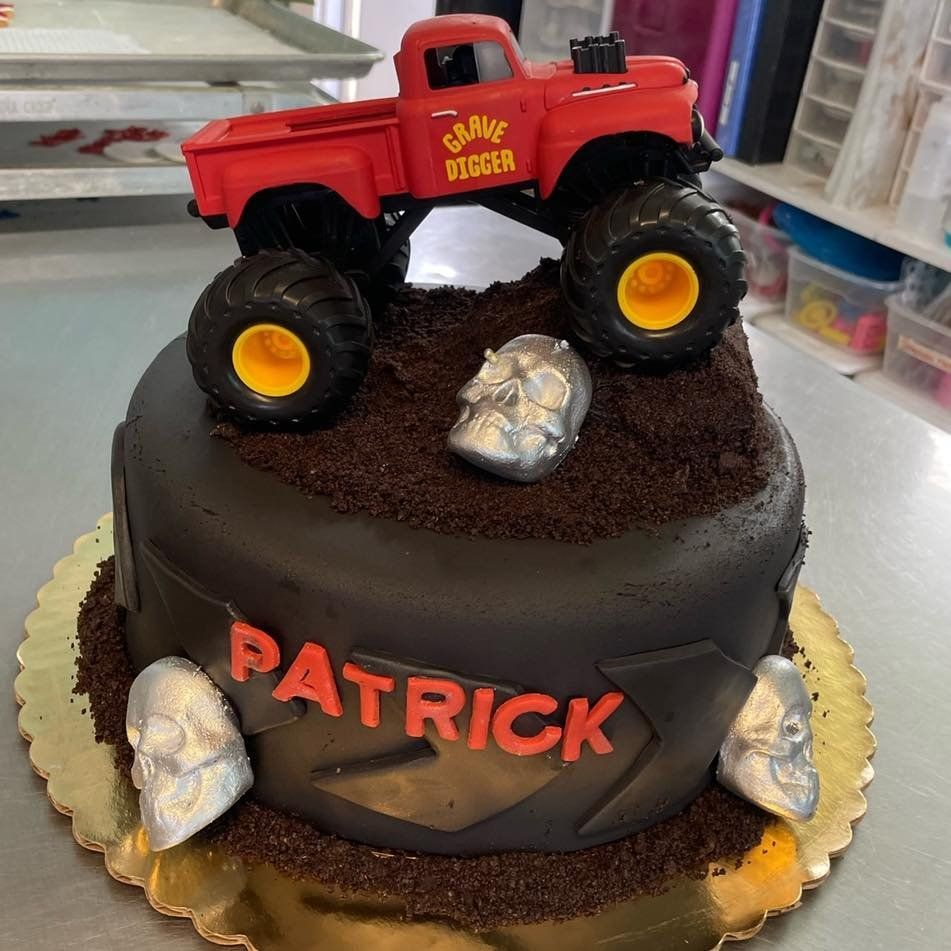 A cake for patrick with a monster truck on top