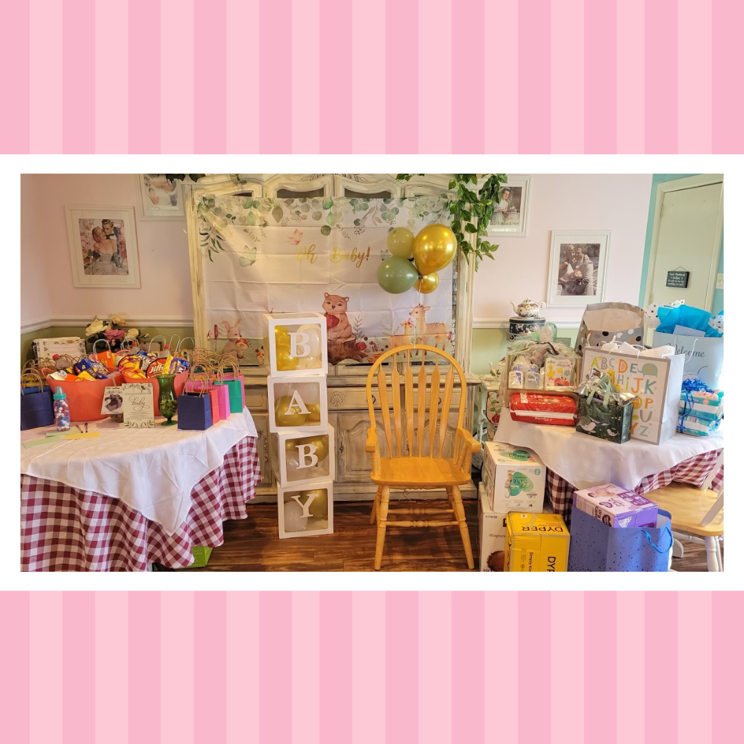 A room filled with lots of gifts and balloons for a baby shower.
