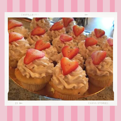 A bunch of cupcakes with whipped cream and strawberries on top