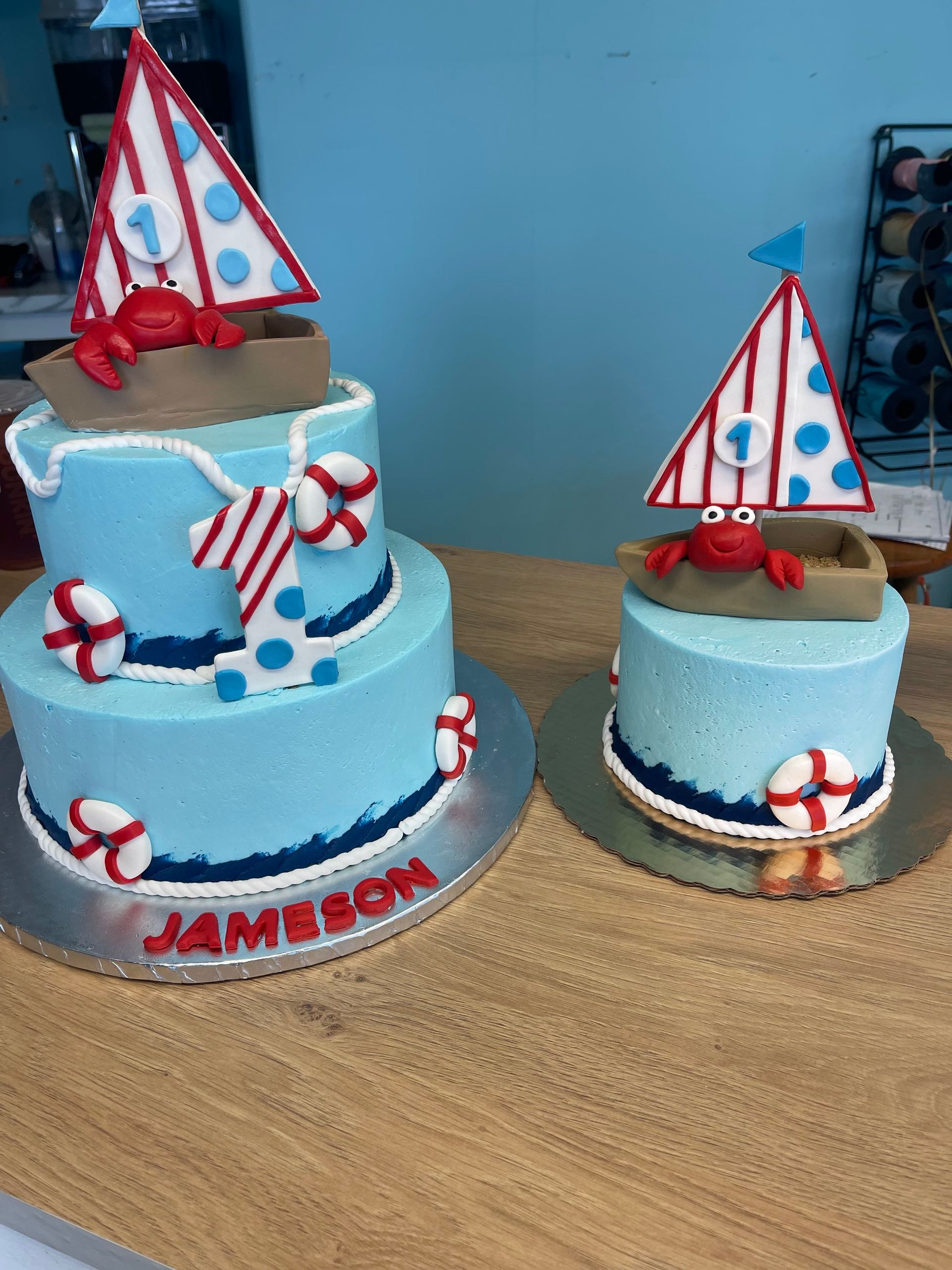 Two cakes on a table with one that says jameson on it