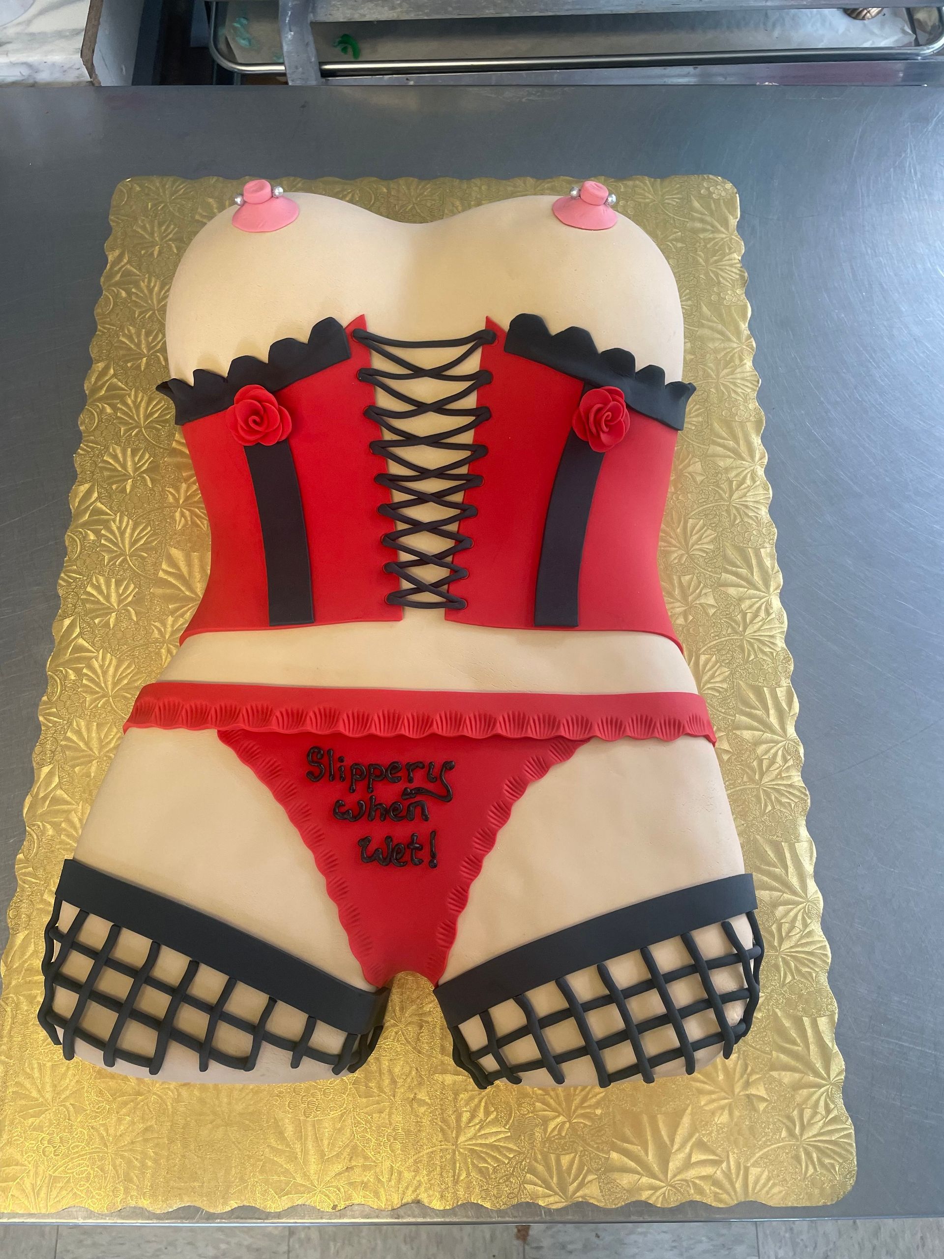 A cake in the shape of a woman 's underwear with the words 