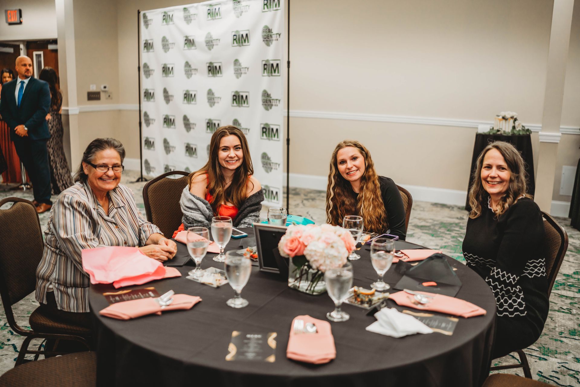 Real Identity Ministries sober soiree event photo shoot - group seated together at the dinner table