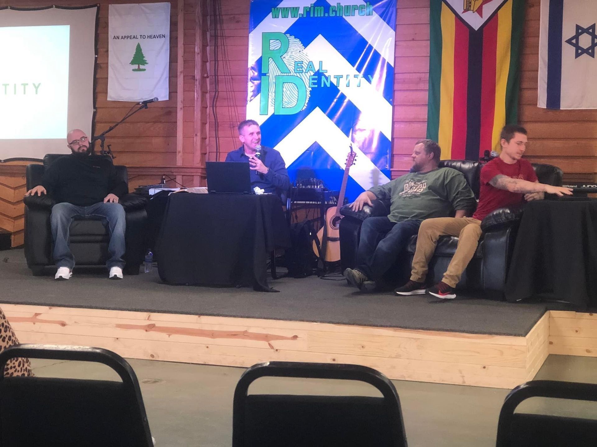 Real Identity Ministries - group talking on stage