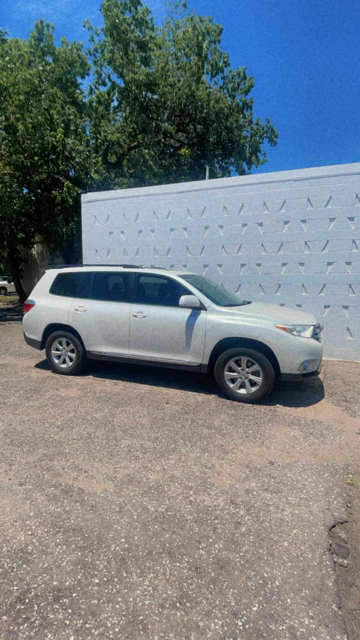 A White SUV Is Parked in Front of A White Wall | Wichita, KS | ICT Pros Window