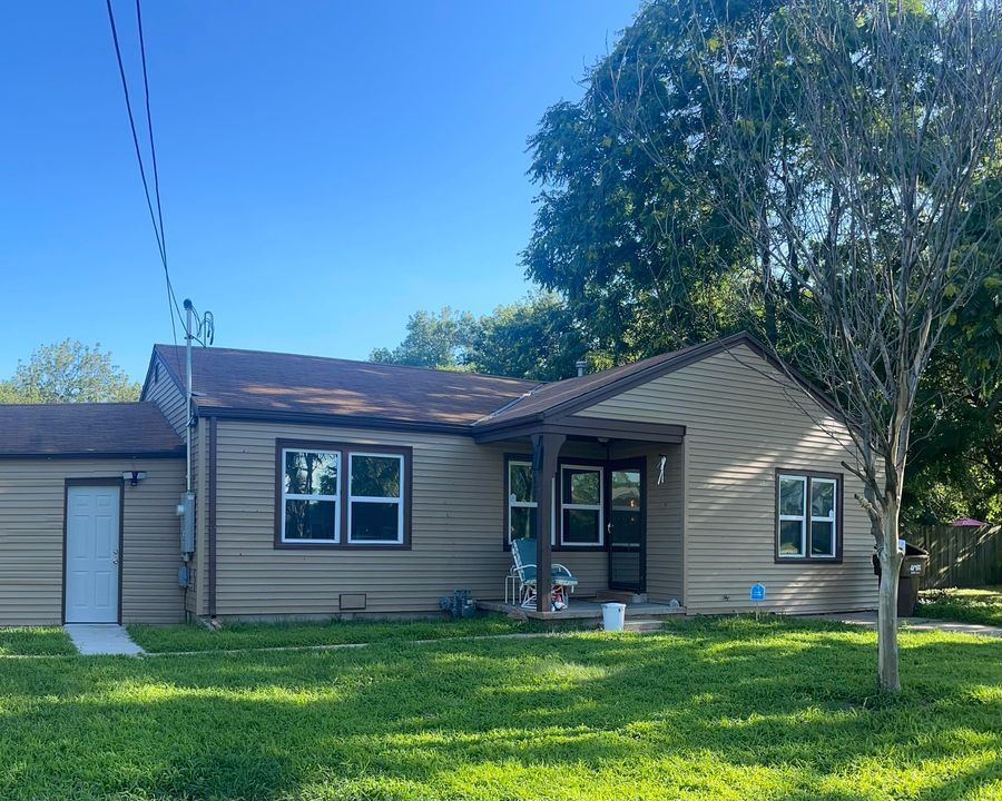A Small House with A Lot of Windows and A Rocking Chair on The Porch | Wichita, KS | ICT Pros Window