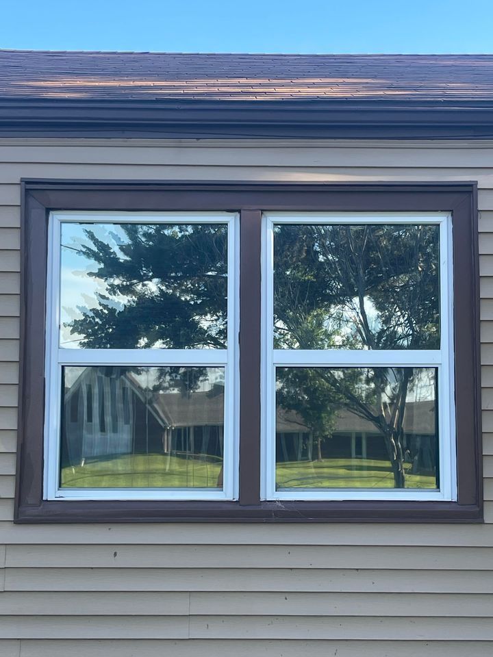 A Window on The Side of A House with Trees Reflected in It | Wichita, KS | ICT Pros Window