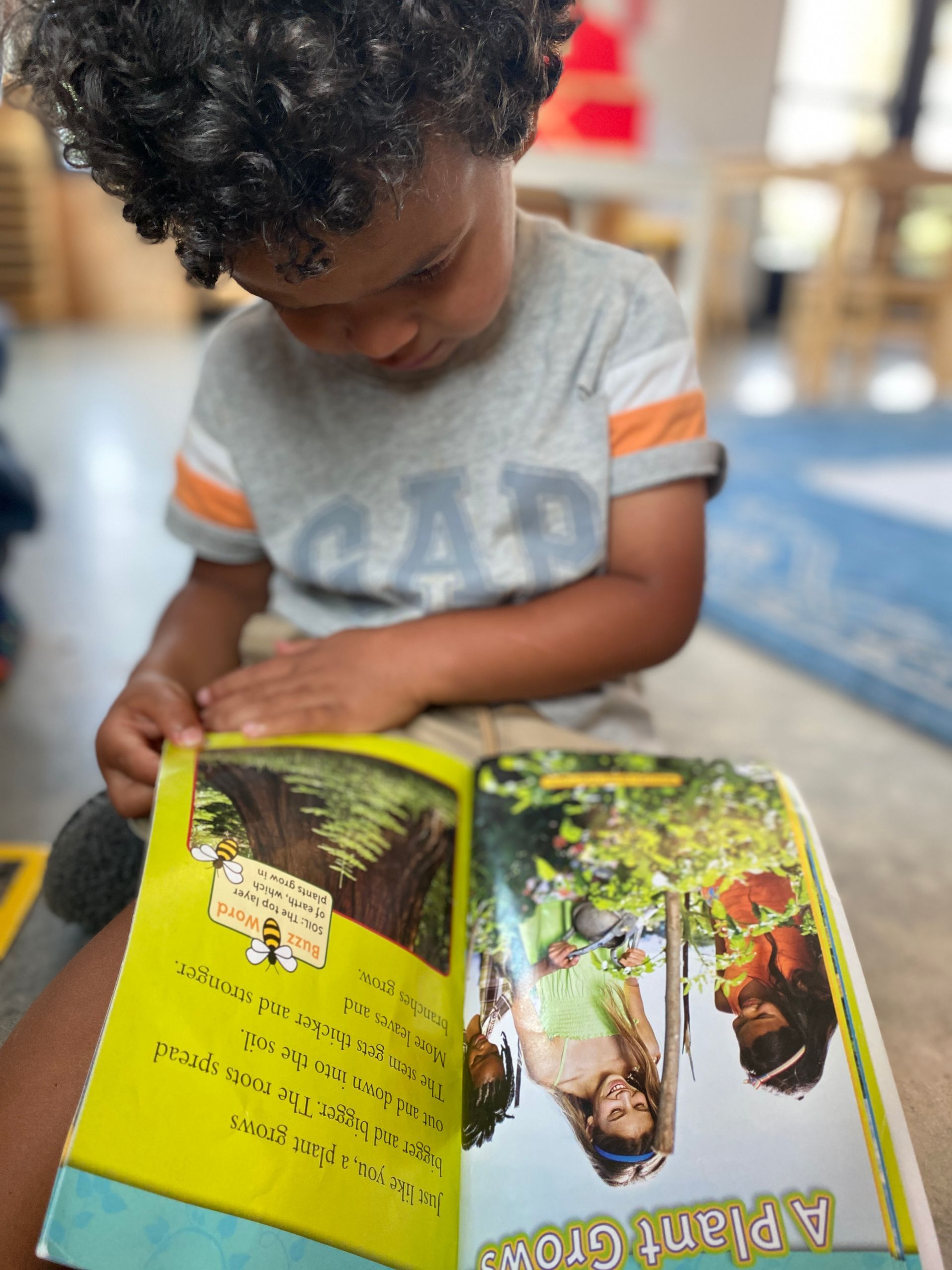 An IMA student enjoys a book.
