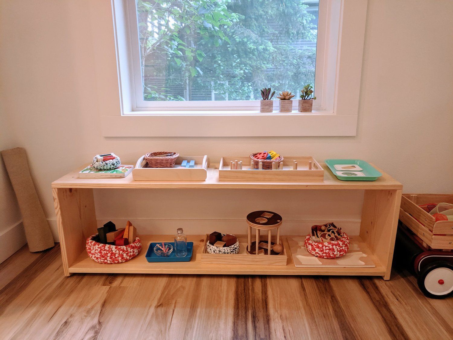 A Montessori shelf in the play area of the home. 