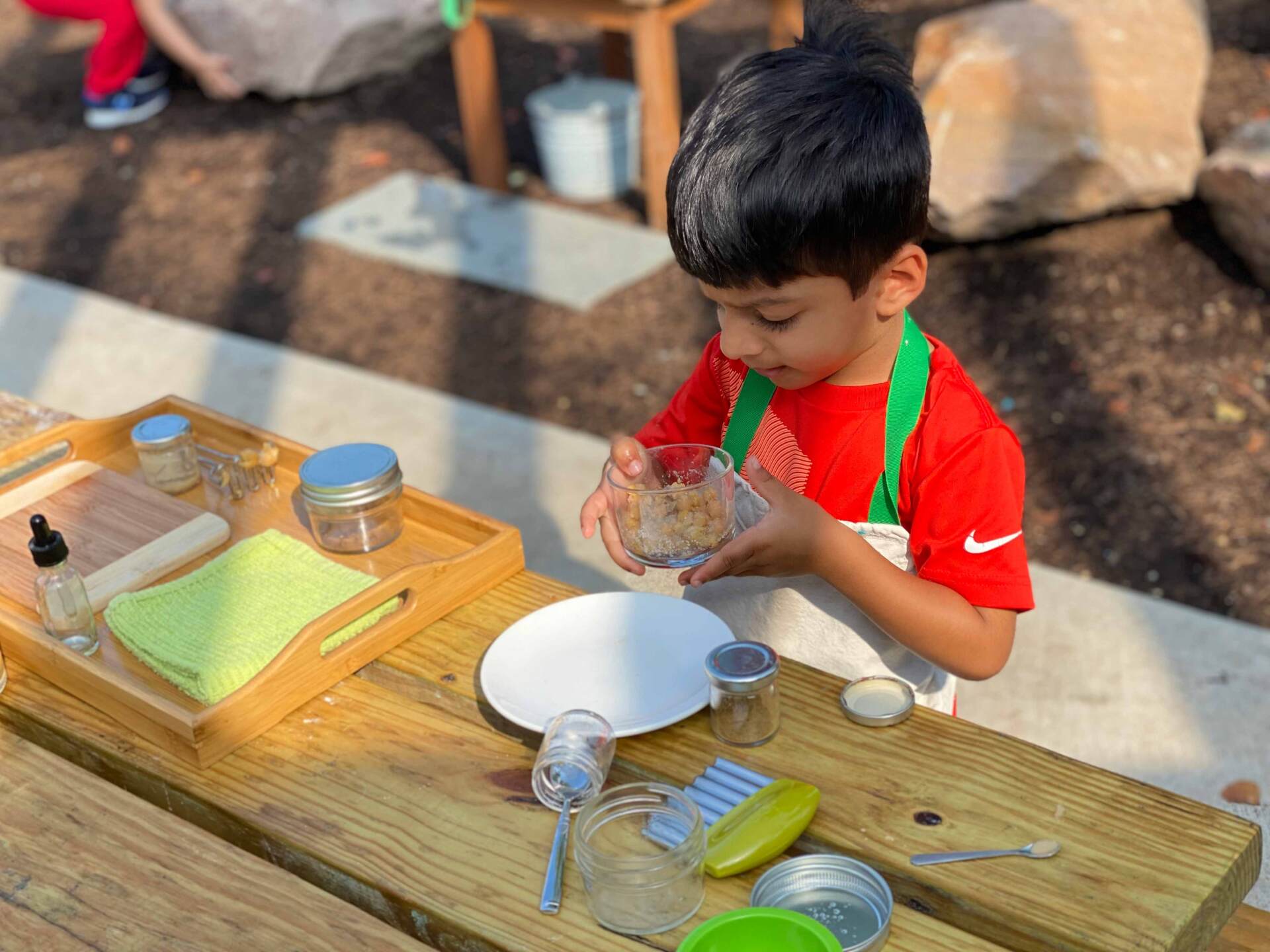 A Kid cleaning glass