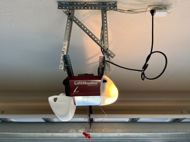 Improperly mounted garage door opener needing repair