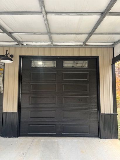 Modern residential garage door installed by All Weather Garage Doors