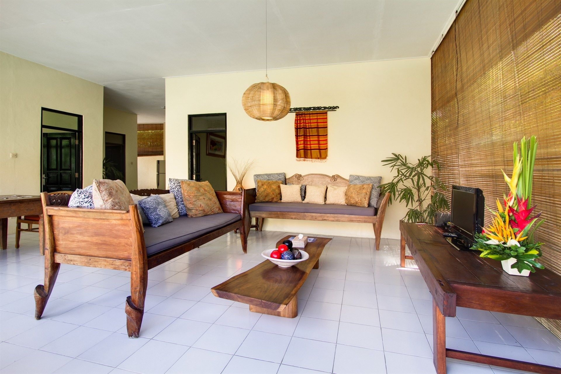 A living room with a couch , table and television