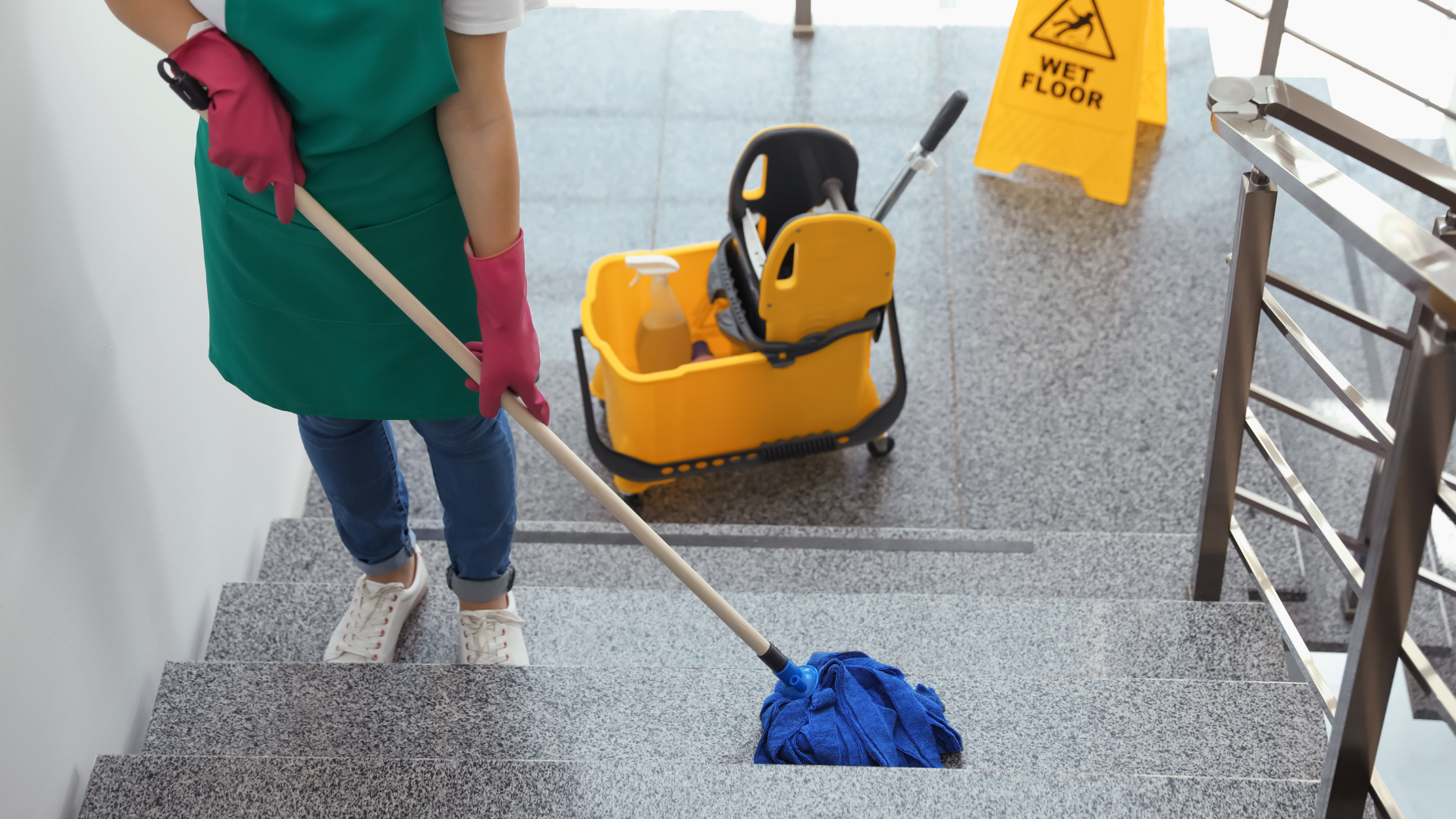 A man is shoveling snow from a driveway in front of a house.