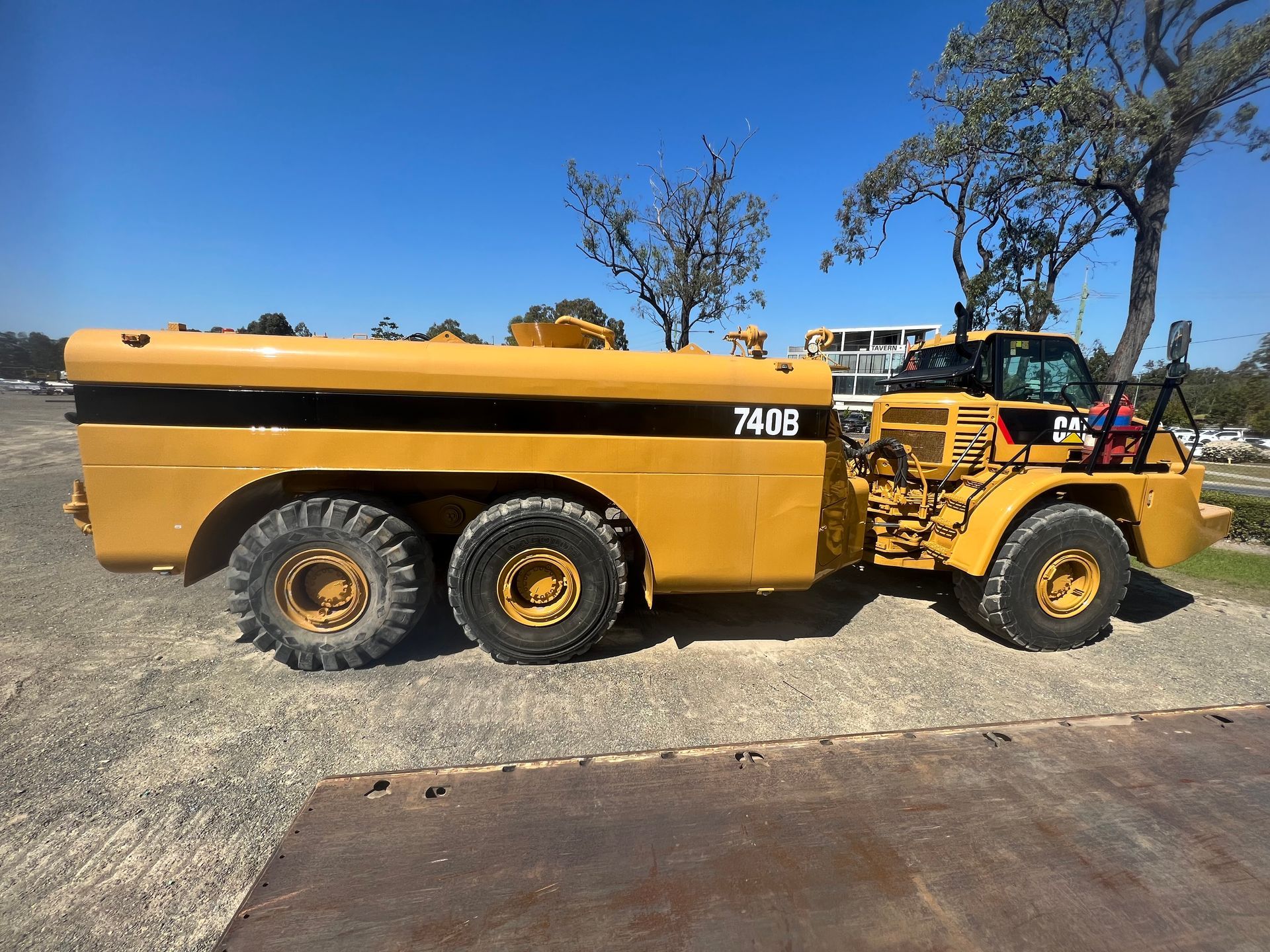 A large yellow truck with the number 7448 on the side