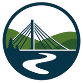 Blue circle logo with a bridge, river, trees, and green hills.