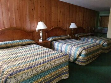 Bed in motel room— affordable motel in Georgetown, SC
