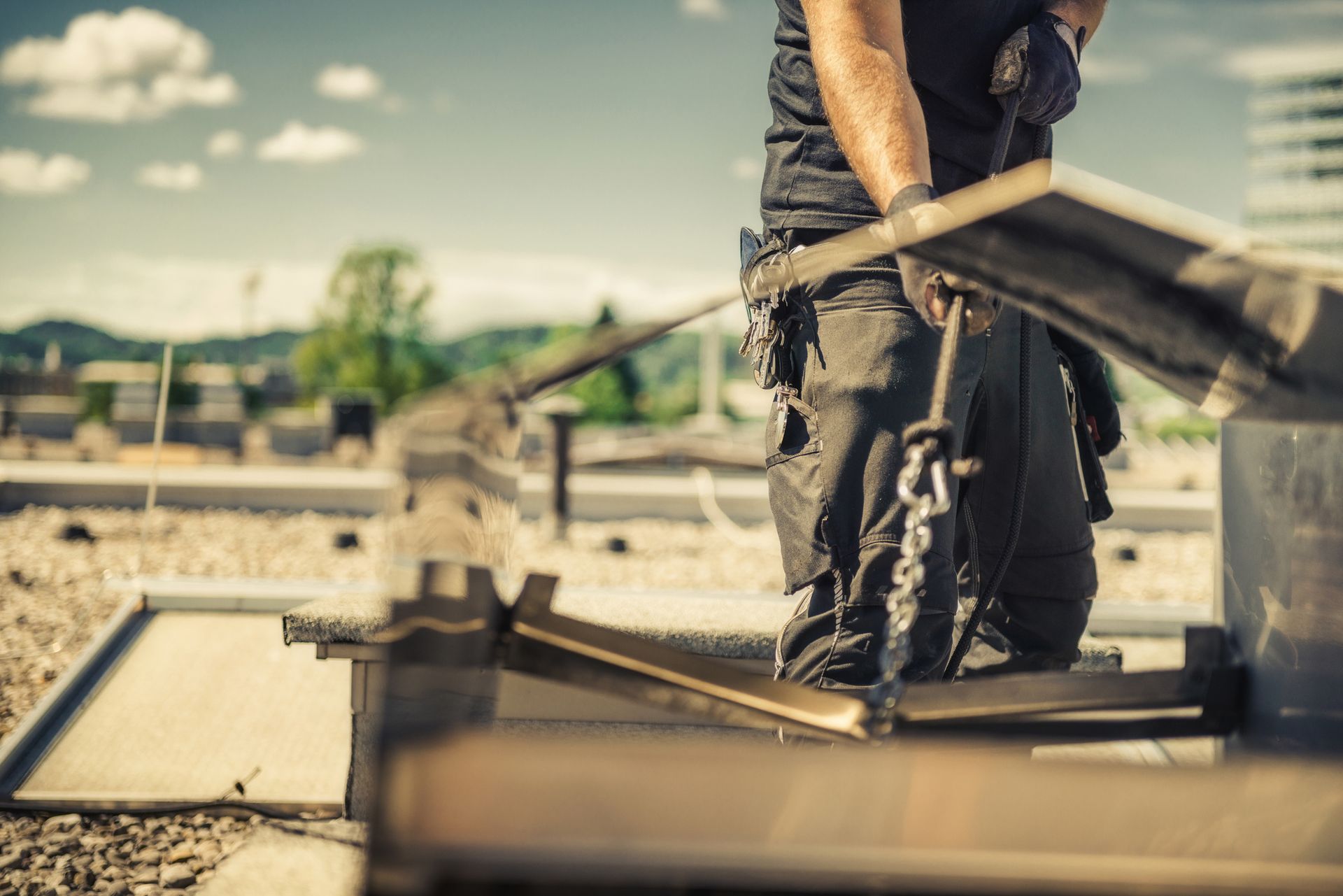 A professional chimney sweep in uniform inspecting a brick chimney, showcasing proper tools and equi