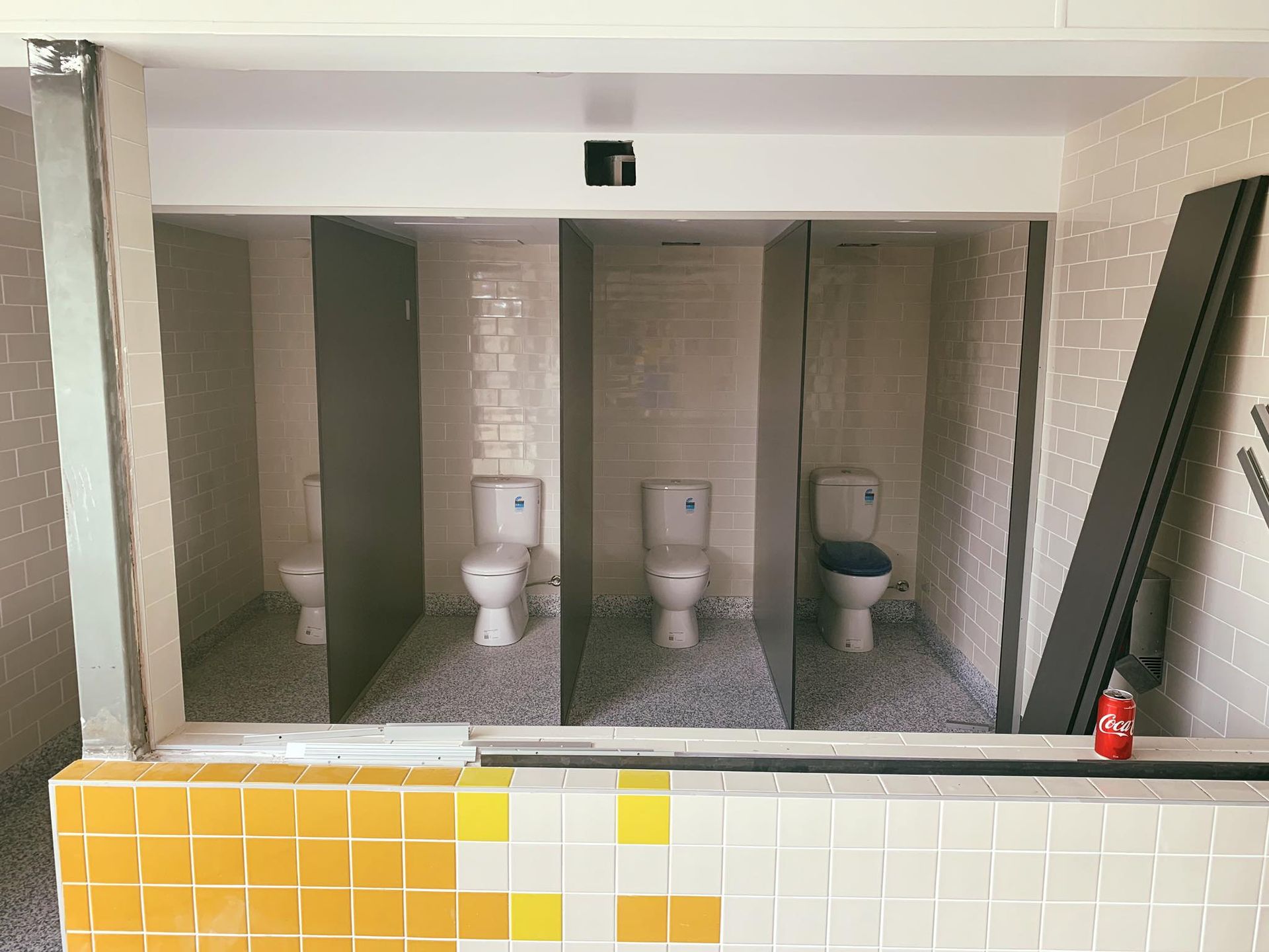 A Large Green Tank is Being Lifted by a Crane — Reed Plumbing Industries in Mackay, QLD