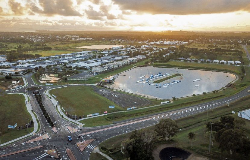 An Aerial View of a Beach With a City in the Background — Reed Plumbing Industries in Andergrove, QLD