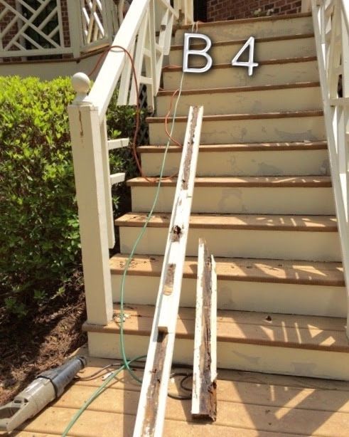 Exterior stairs with damaged white molding and power tools on a porch. 
