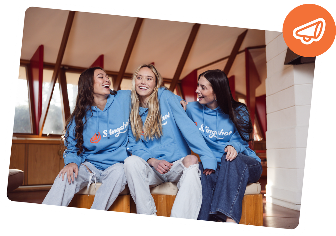 Student leaning on Slingshot box