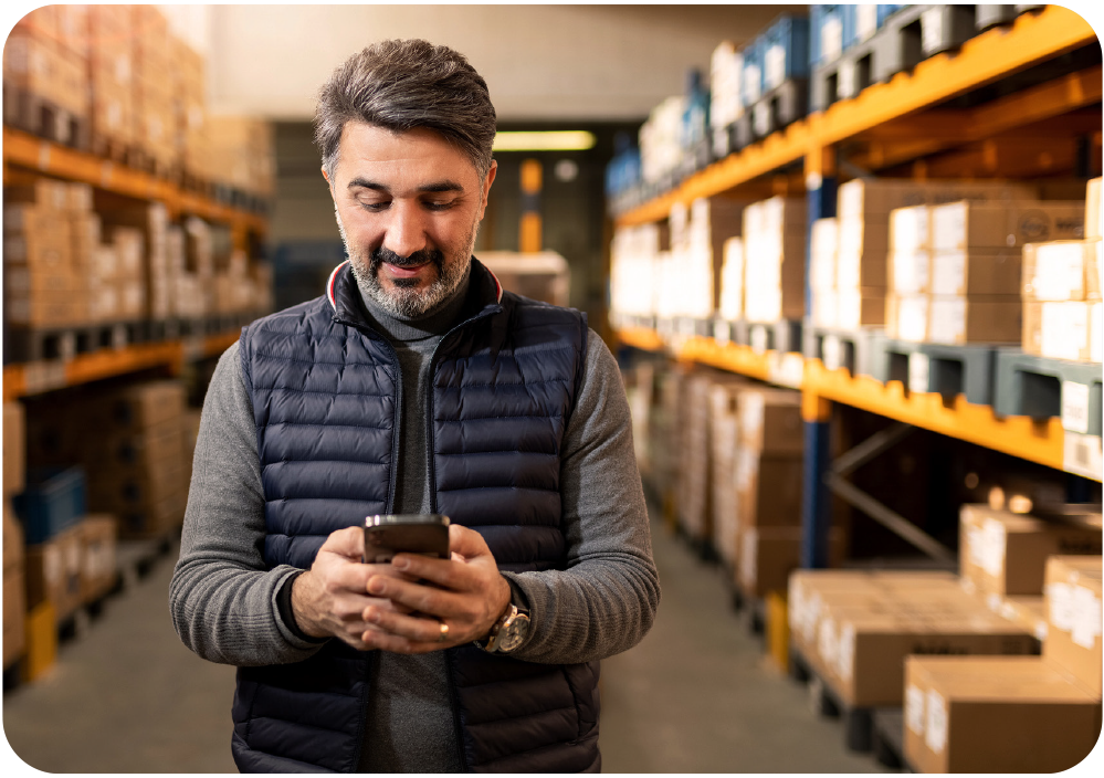 Man in warehouse on mobile phone