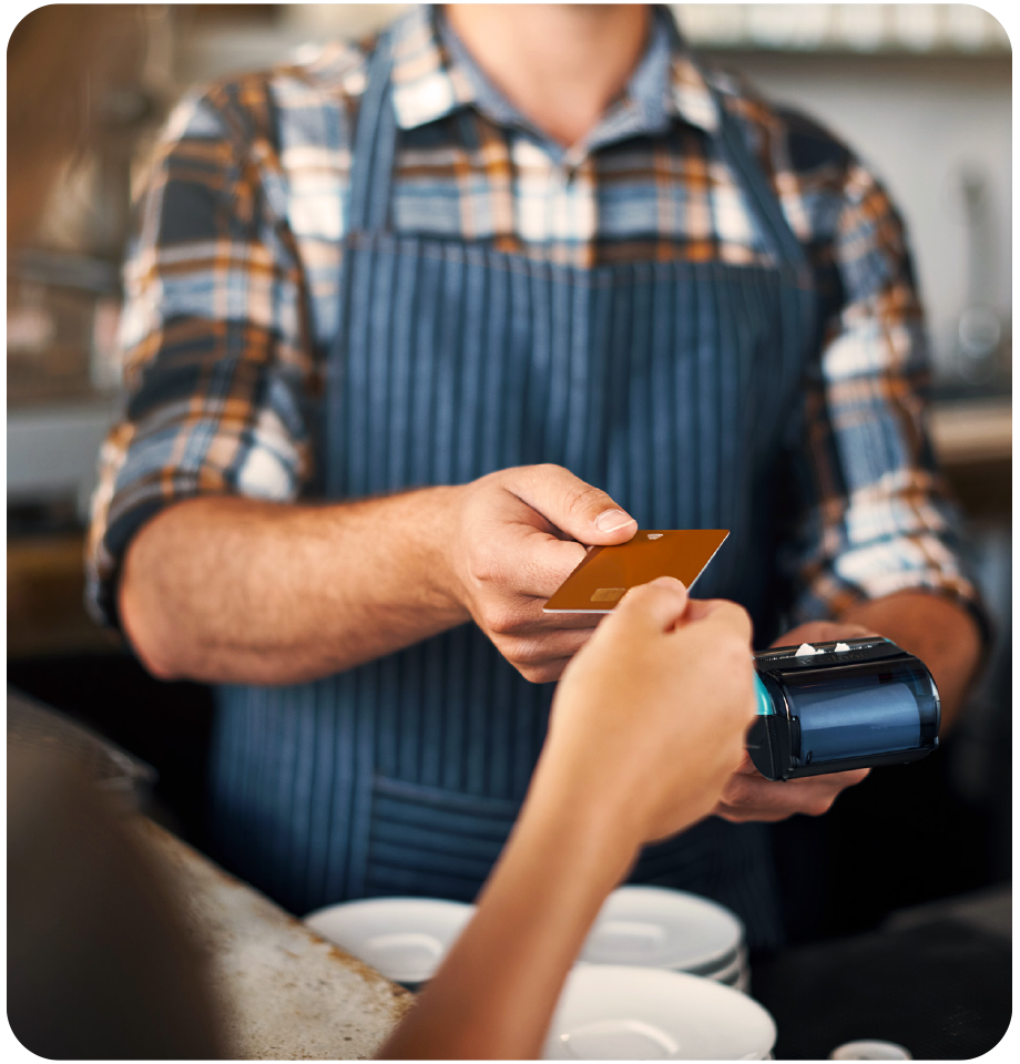 Customer making card payment at cafe