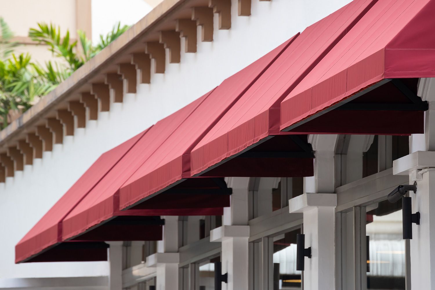 Red awnings mounted in the exterior of a building