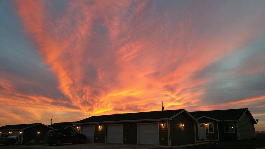 A view of the Prairie Meadows Townhomes at sunset