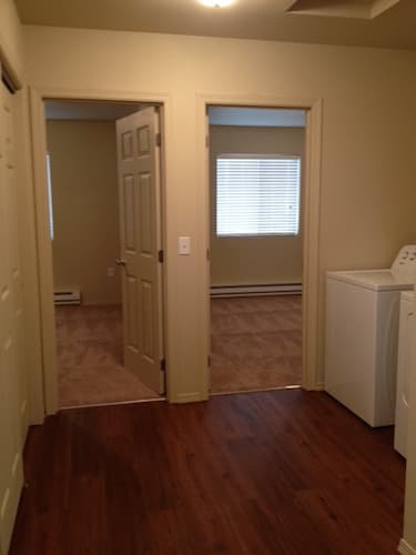 Hallway with laundry nook with full size appliances