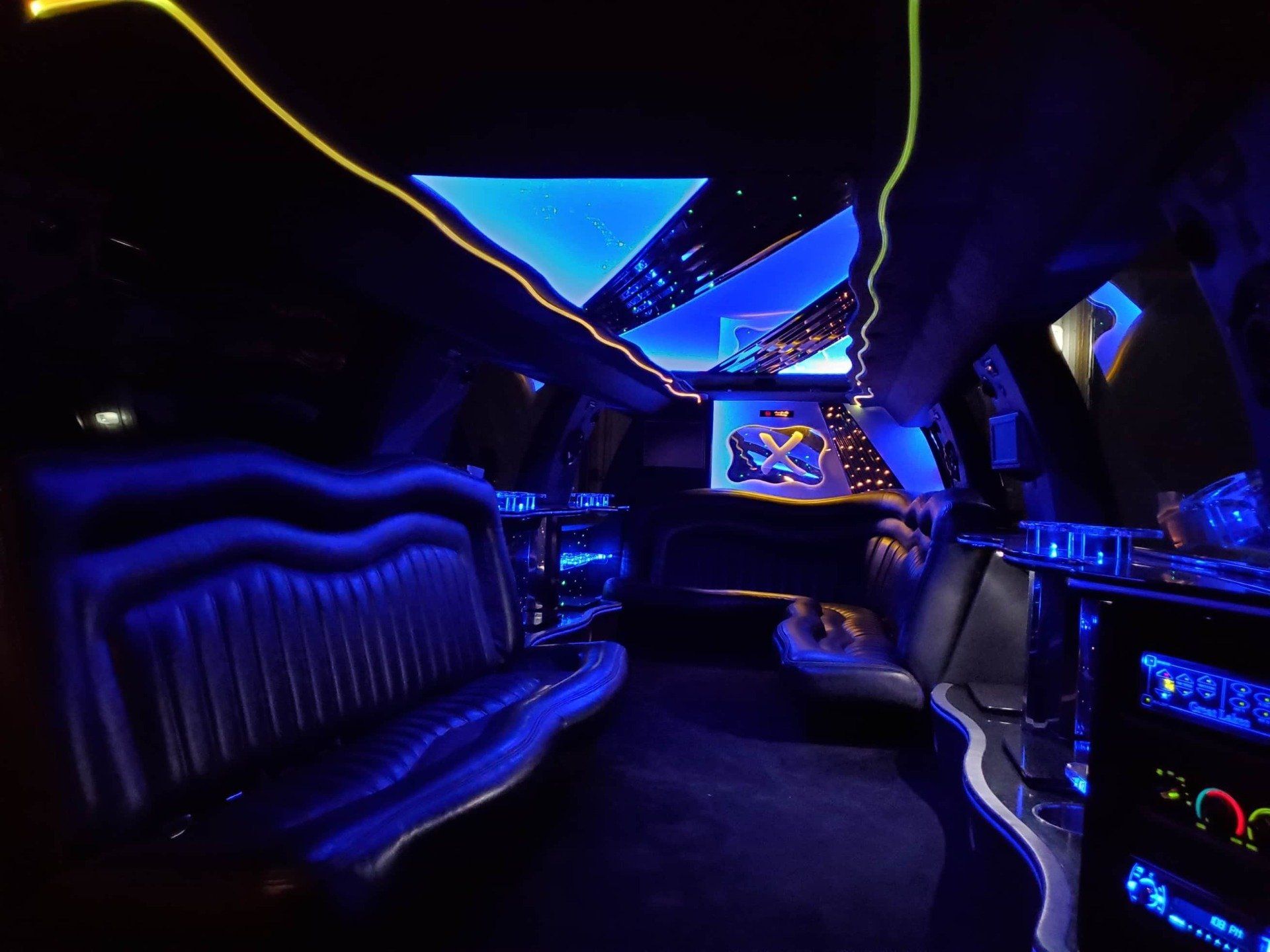 The interior of a limo in Iowa City is lit up with blue lights.