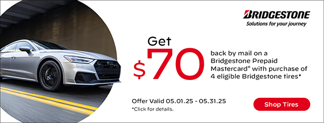 An ad for Bridgestone tires shows a silver car on the road.