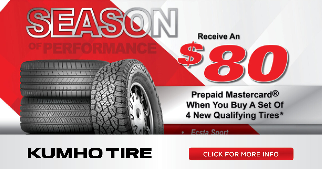 A stack of Kumho tires on a red and white background