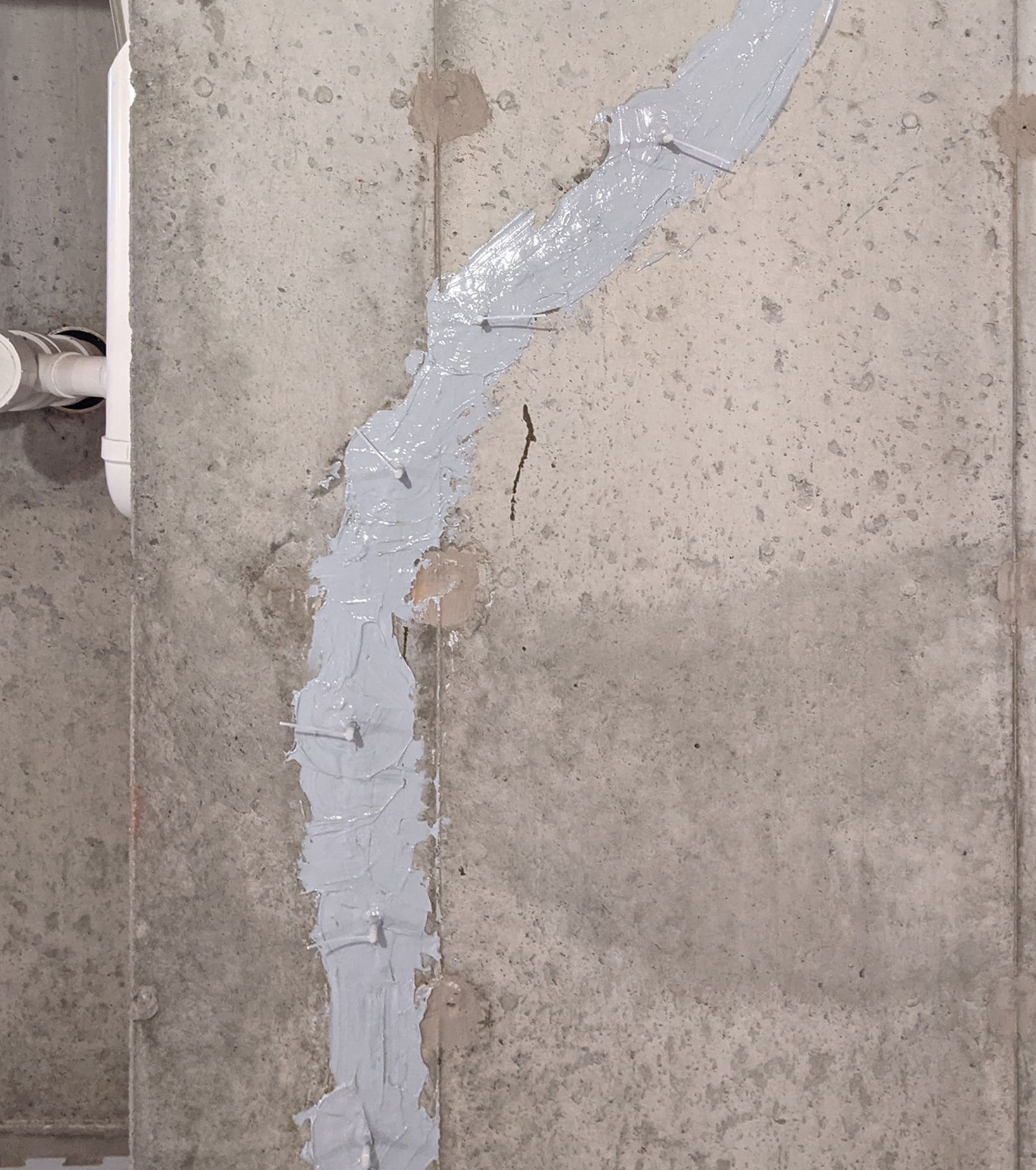 A sealed crack in a foundation wall