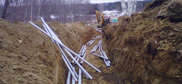 Excavation Site With Scattered Pipes — Cape Elizabeth, ME — L.P. Murray & Sons, Inc.