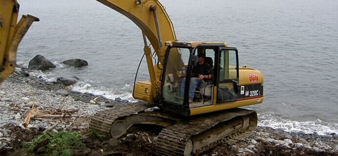 Man In Excavator Working — Cape Elizabeth, ME — L.P. Murray & Sons, Inc.