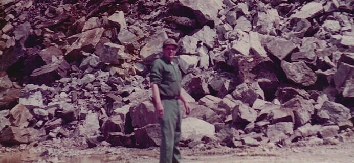 Man In Front Of Large Rocks — Cape Elizabeth, ME — L.P. Murray & Sons, Inc.