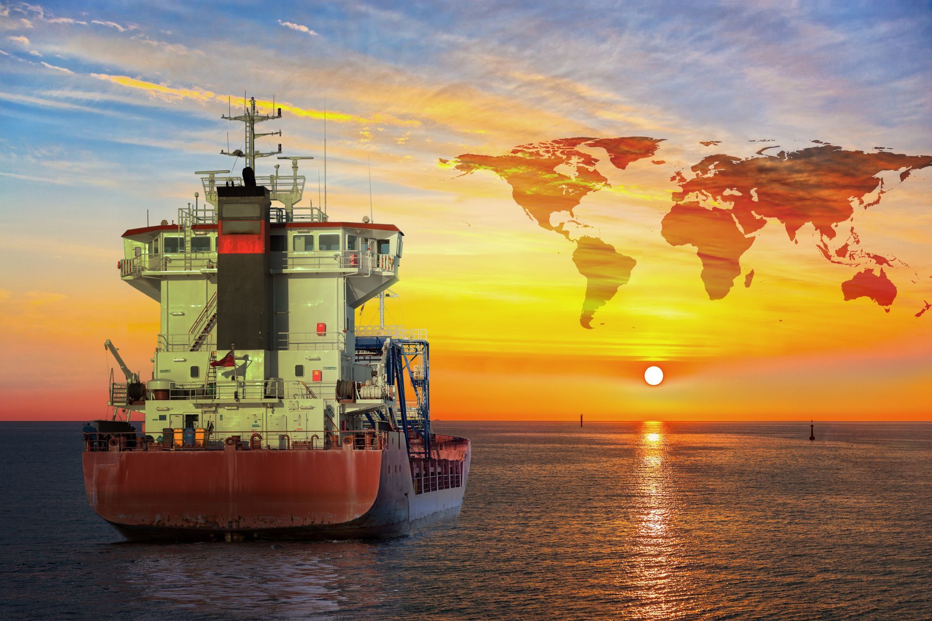 Cargo ship sailing on the ocean at sunset with a world map superimposed over the sky.