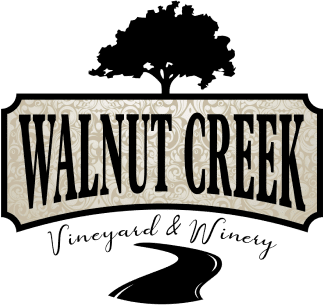 Logo for Walnut Creek Vineyard & Winery, featuring a black tree atop a sign with the words 