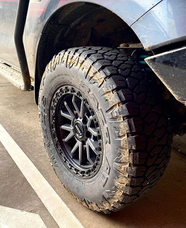 Close Up of a Tire on a Car in a Parking Lot — Capricorn Tyre & Mechanical in Yeppoon, QLD