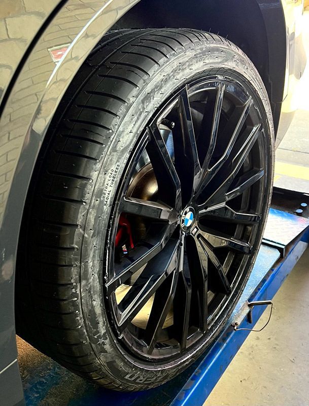 Close Up of a BMW Wheel on a Lift — Capricorn Tyre & Mechanical in Yeppoon, QLD