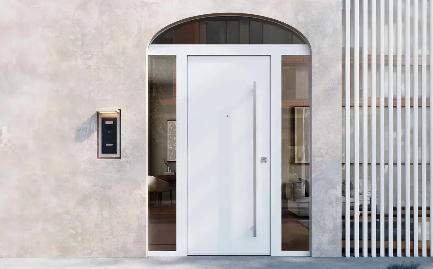 Una porta bianca è posizionata sul lato di un edificio accanto a una cassetta della posta.