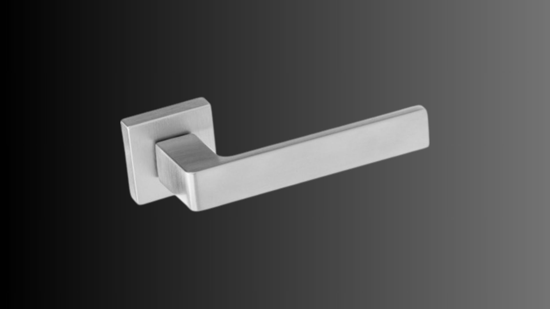 Una maniglia per porta in acciaio inossidabile su sfondo nero.